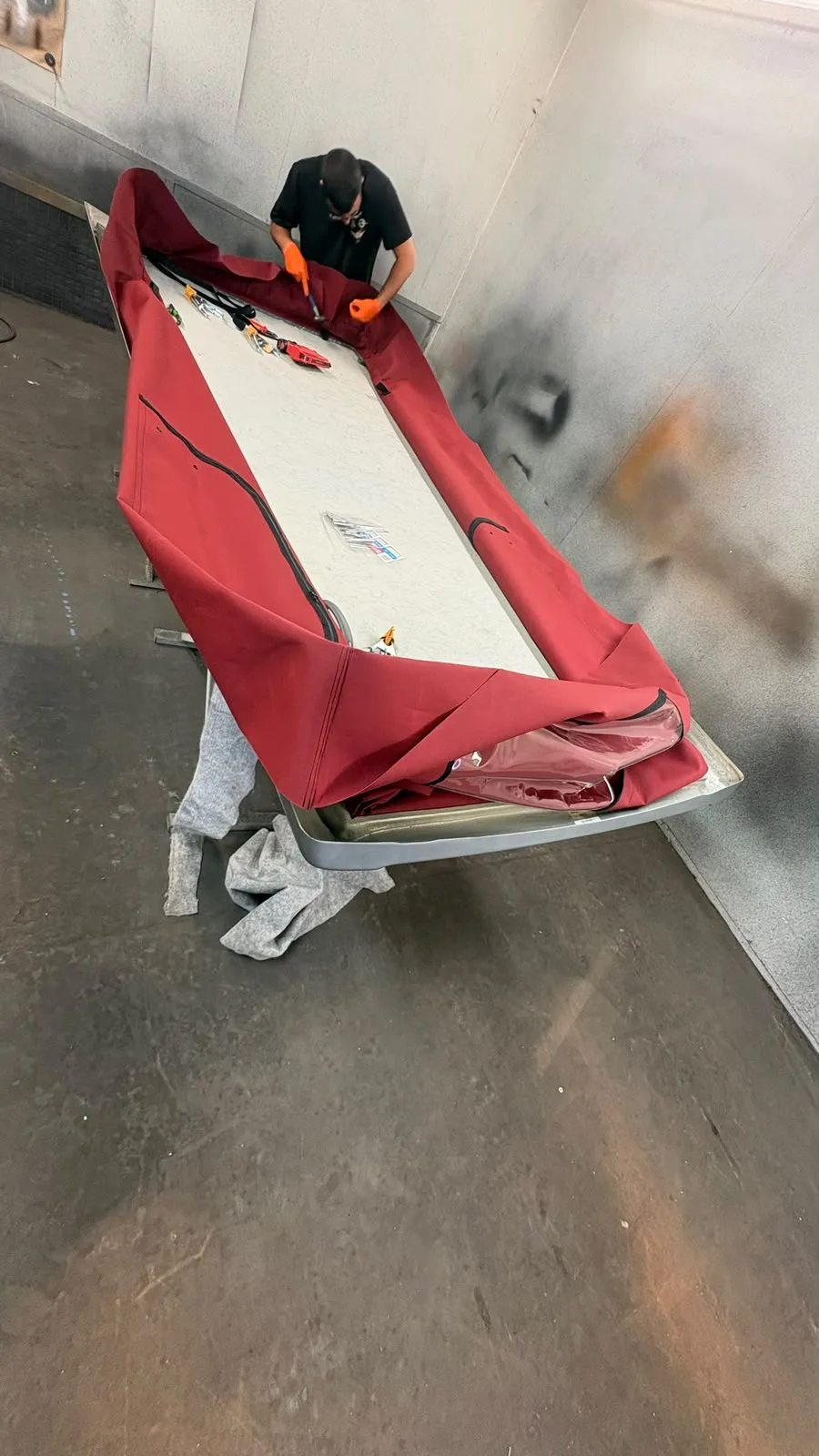 Side view of the red canvas and detached pop-top roof